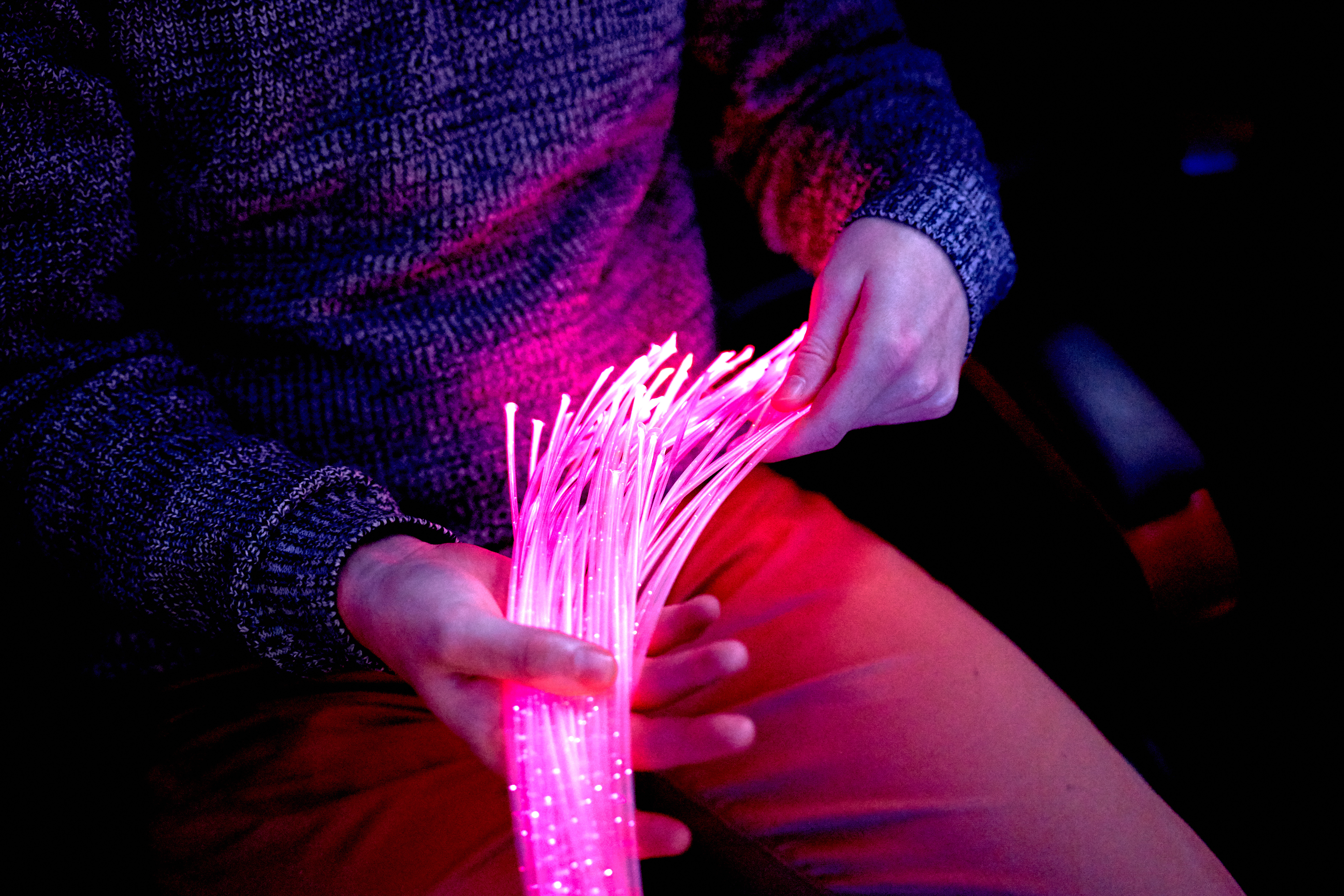 man in color therapy in the retirement care home. multi sensory stimulating room